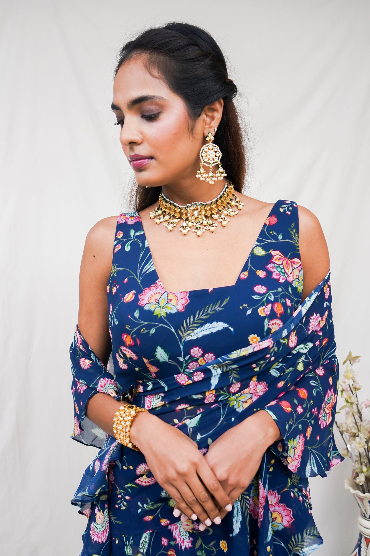 Navy blue pre pleated sari and printed blouse with an embellished hem