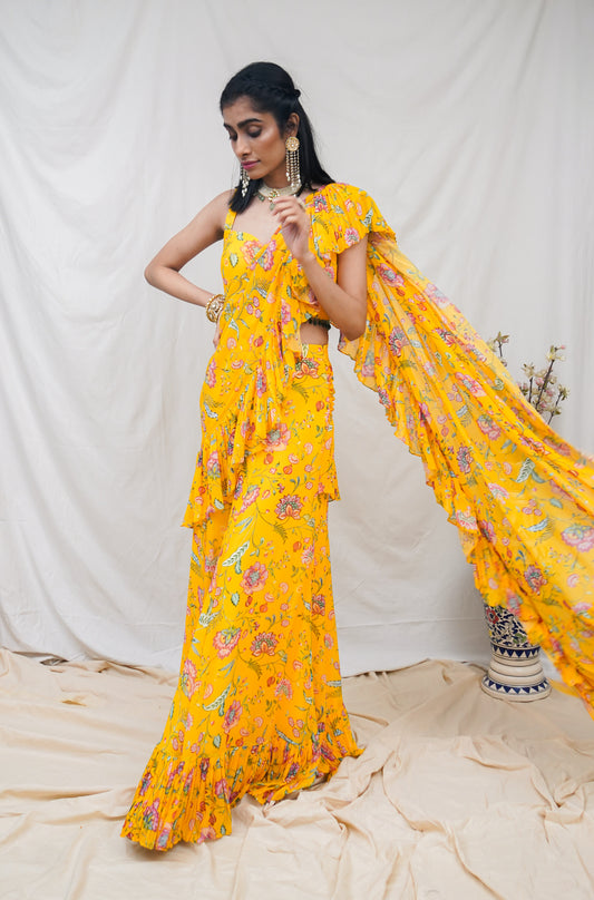 Yellow pre pleated ruffle sari and printed blouse with an embellished hem