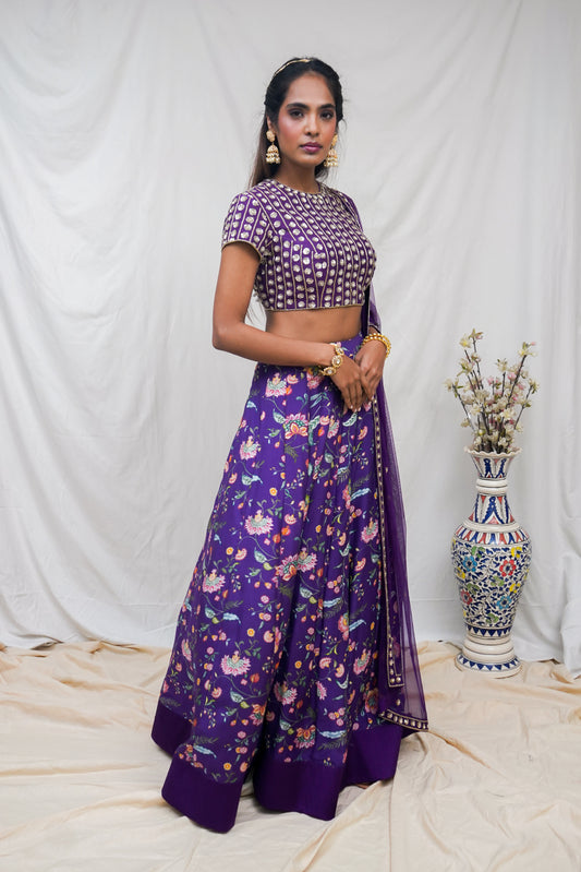 Deep purple hand embroidered blouse and dupatta with a high waisted floral printed lehenga