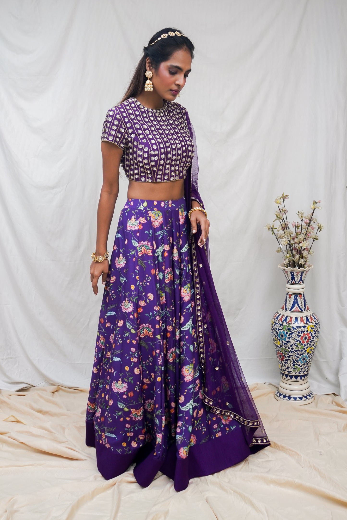 Deep purple hand embroidered blouse and dupatta with a high waisted floral printed lehenga