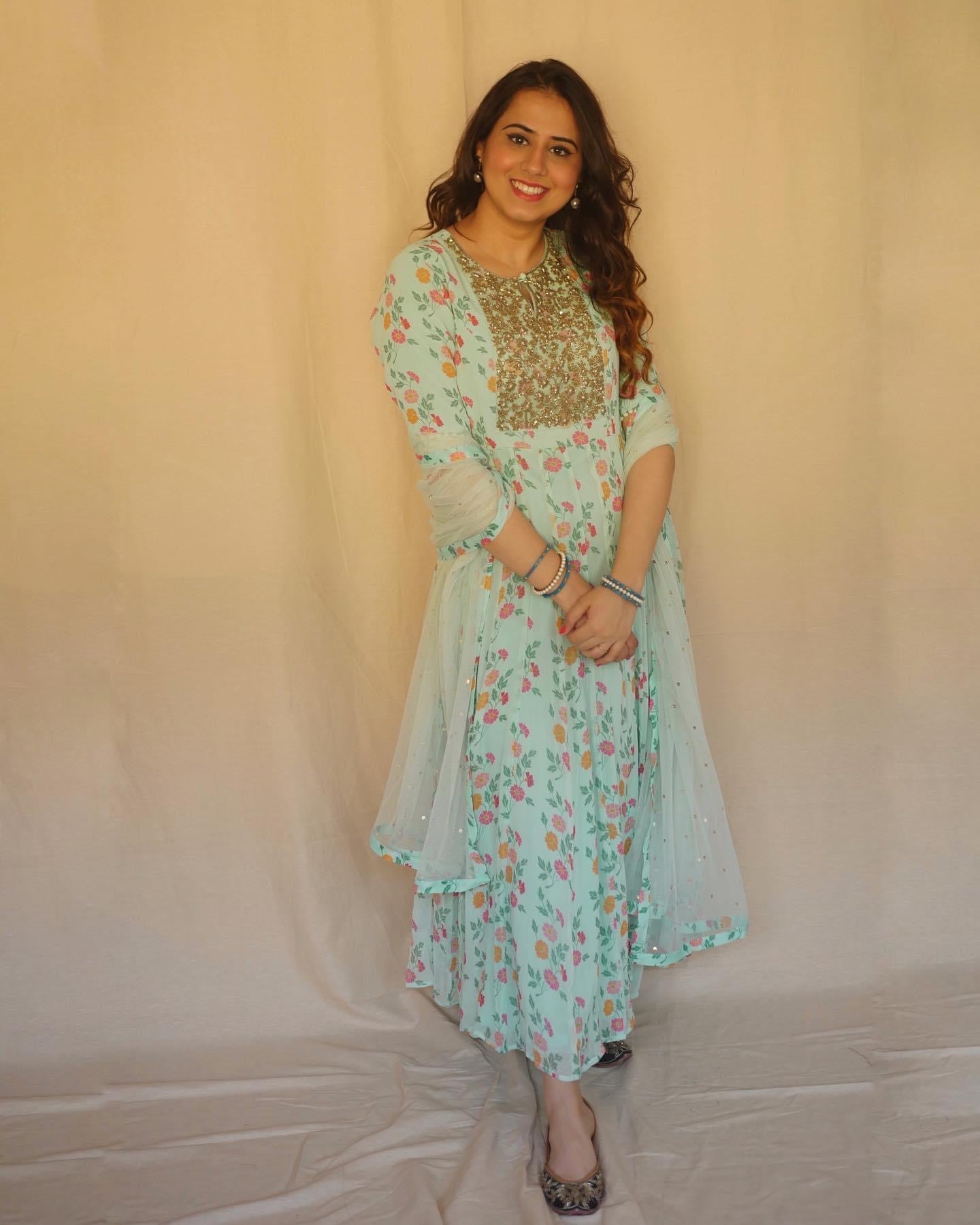 Aqua anarkali with a hand embroidered yoke, churidaar and dupatta