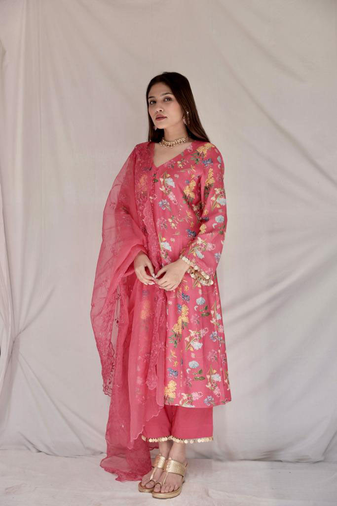 Floral printed carrot red kurta set with gold coin detailing and a cutwork dupatta