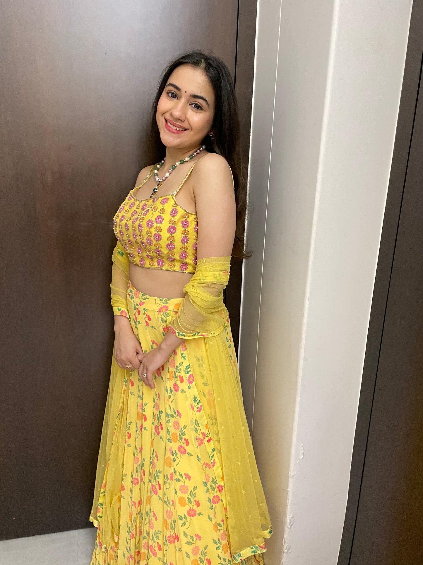 Yellow floral lehenga with a hand embroidered blouse and dupatta