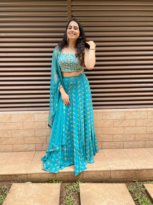 Peacock blue floral printed lehenga with a hand embroidered blouse and dupatta