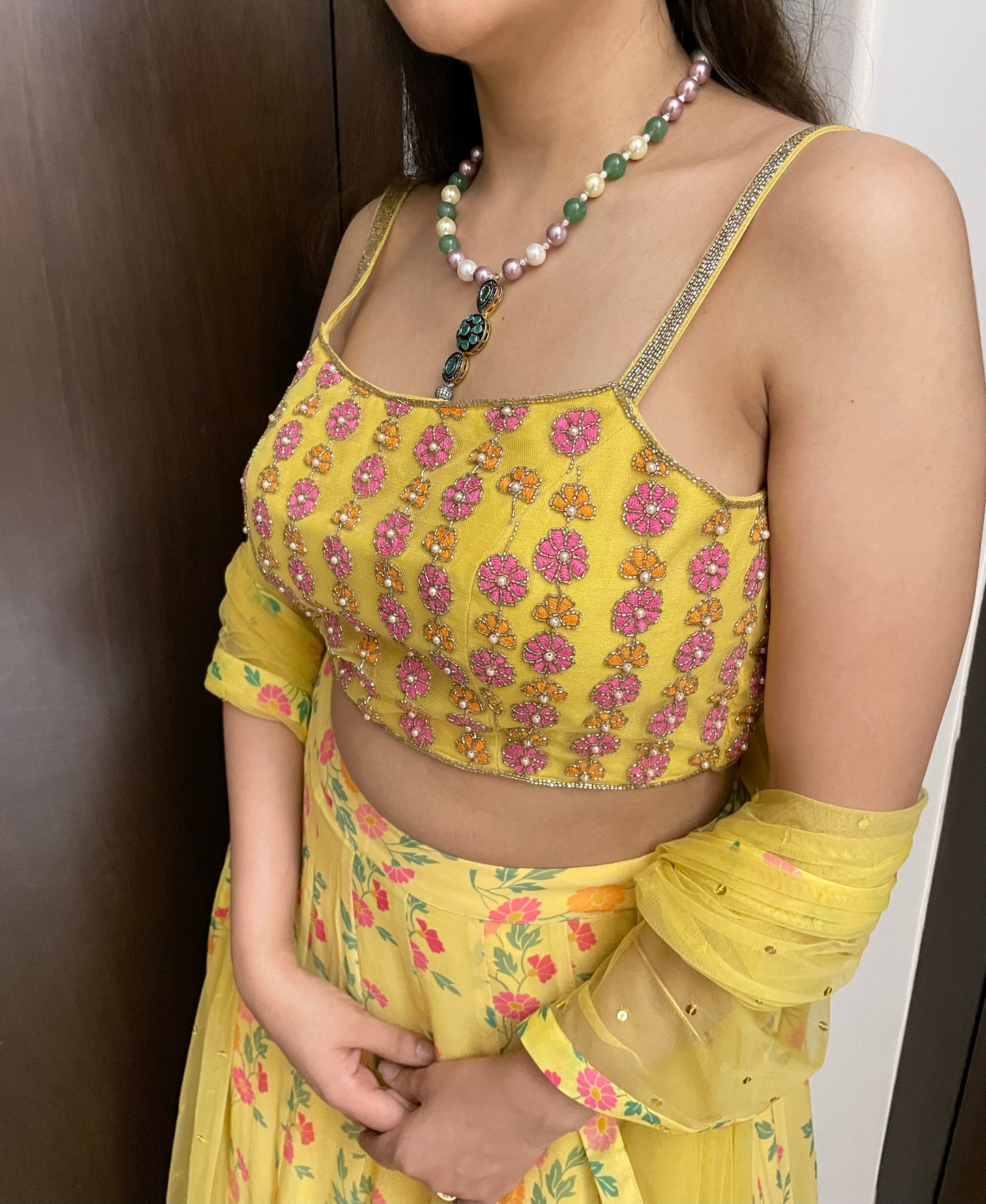 Yellow floral lehenga with a hand embroidered blouse and dupatta