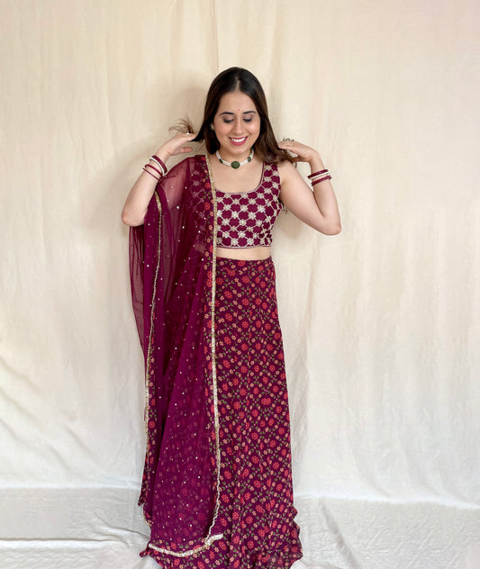 Wine floral printed lehenga with a hand embroidered criss cross blouse and dupatta