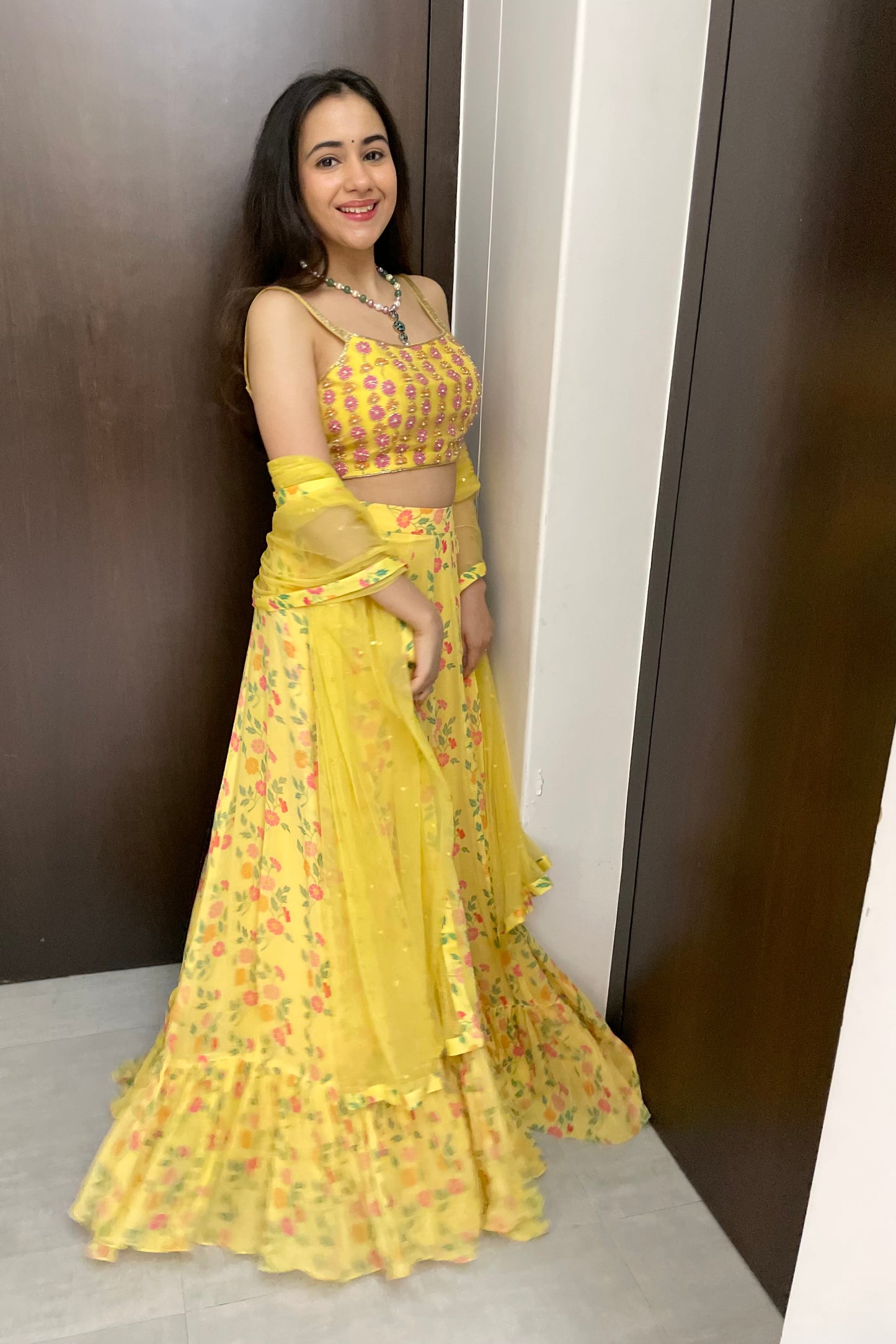 Yellow floral lehenga with a hand embroidered blouse and dupatta