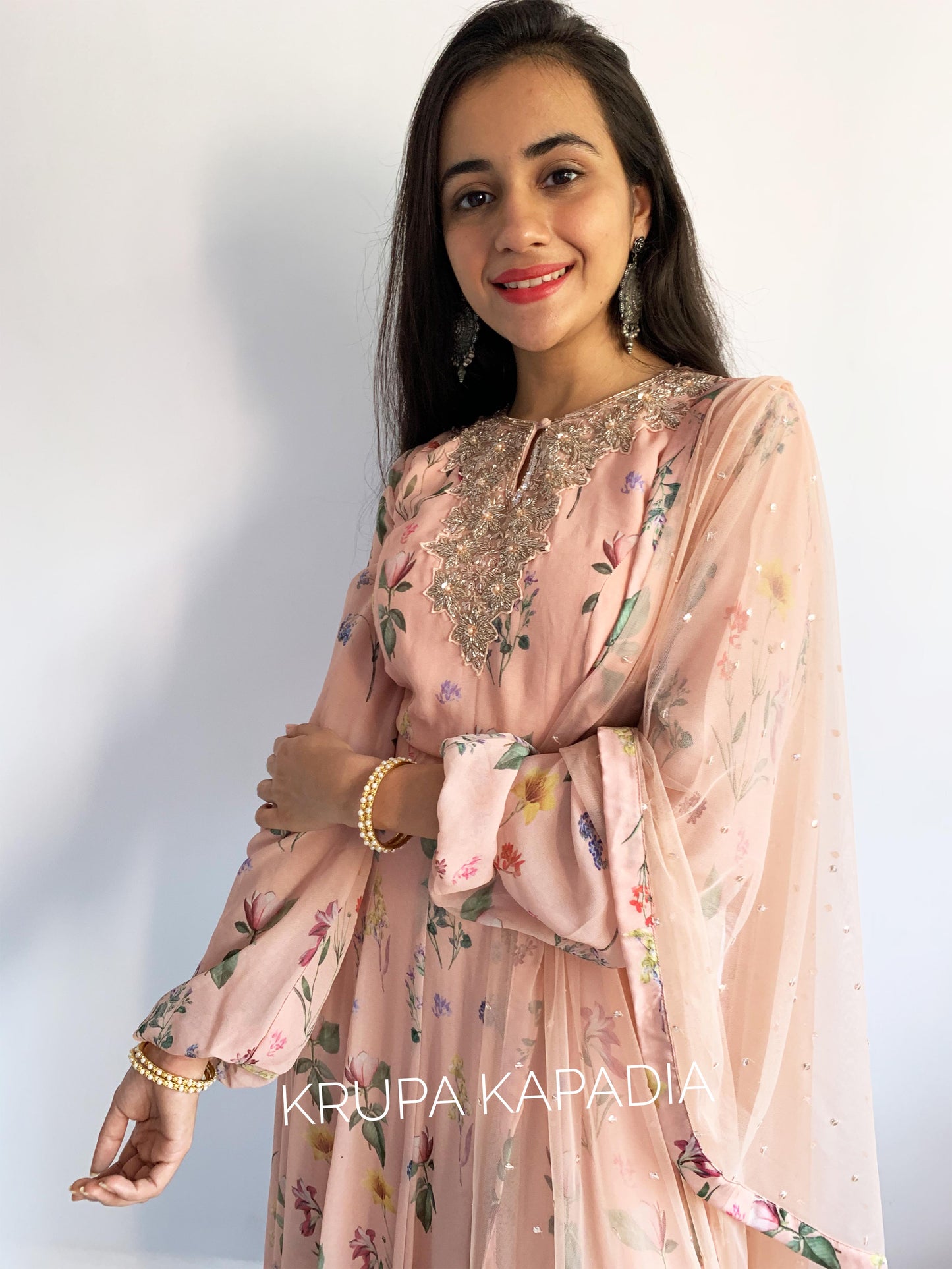 Peach floral printed anarkali with a hand embroidered yoke and dupatta